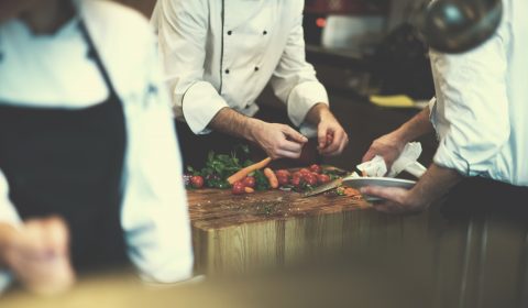 team cooks and chefs preparing meal