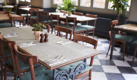 Tables Laid For Service In Empty Restaurant